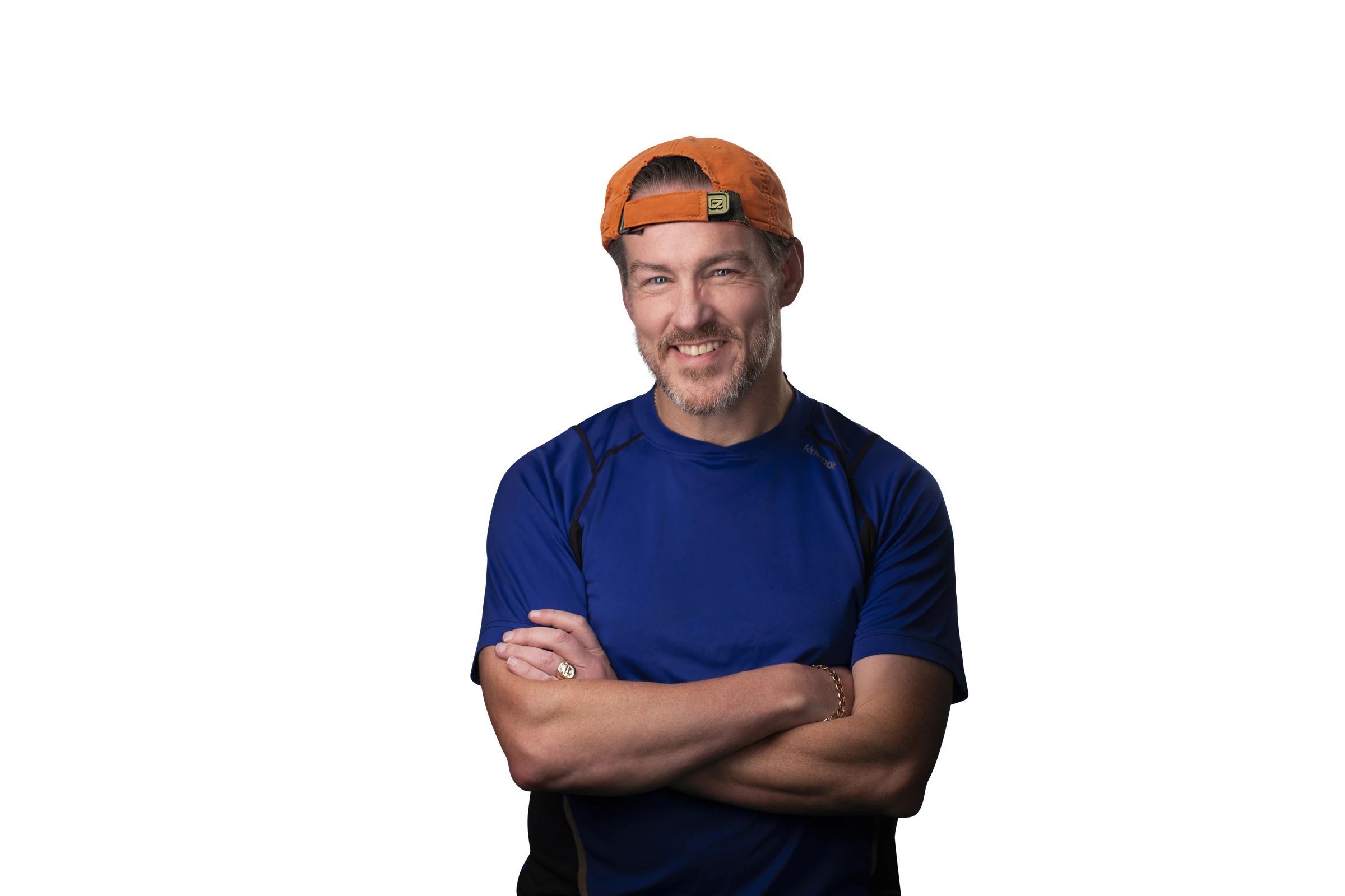 Shay Lynch, smiling with arms crossed, wearing an orange cap and blue running shirt